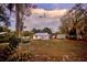 Backyard features mature trees and storage shed at 200 Spurlock Rd, Frostproof, FL 33843