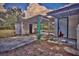 View of the backyard and storage area with covered patio at 200 Spurlock Rd, Frostproof, FL 33843