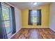 This bedroom features lots of natural light and laminate floors at 200 Spurlock Rd, Frostproof, FL 33843