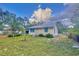 Charming home featuring freshly cut green grass and a well-maintained landscape at 200 Spurlock Rd, Frostproof, FL 33843