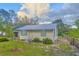 Charming home featuring freshly cut green grass and a well-maintained landscape at 200 Spurlock Rd, Frostproof, FL 33843