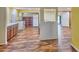 Bright living room featuring a bar style counter, hardwood flooring and many entrances at 200 Spurlock Rd, Frostproof, FL 33843