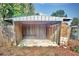 Exterior view of the shed highlighting its frame construction, ready for storage at 200 Spurlock Rd, Frostproof, FL 33843