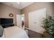 Spacious bedroom with a television, large plant, and direct access to another room at 2026 Indian Sky Cir, Lakeland, FL 33813
