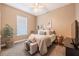 Bedroom showcasing the bed, window, side table, and tasteful decor at 2026 Indian Sky Cir, Lakeland, FL 33813
