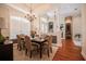 Formal dining room with neutral colors, a chandelier, and a large window for ample natural light at 2026 Indian Sky Cir, Lakeland, FL 33813