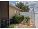 Charming backyard garden featuring a raised garden bed, gravel path, and flourishing plants at 2026 Indian Sky Cir, Lakeland, FL 33813