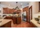 Gourmet kitchen with stainless steel appliances, granite countertops, and a central island at 2026 Indian Sky Cir, Lakeland, FL 33813