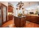 Spacious kitchen island with stainless steel appliances, granite countertops, and custom cabinetry at 2026 Indian Sky Cir, Lakeland, FL 33813