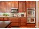 Kitchen featuring stainless steel appliances, granite countertops, and tile backsplash at 2026 Indian Sky Cir, Lakeland, FL 33813