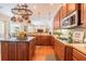 Open kitchen featuring a center island, granite countertops, and stainless steel appliances at 2026 Indian Sky Cir, Lakeland, FL 33813
