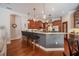 Open kitchen with breakfast bar, granite countertops, stainless steel appliances, and pendant lighting at 2026 Indian Sky Cir, Lakeland, FL 33813