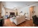 Spacious living room with hardwood floors, modern furnishings, and seamless flow into other living areas at 2026 Indian Sky Cir, Lakeland, FL 33813