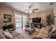 Comfortable living room with sliding doors leading to the pool area, complemented by stylish decor and furnishings at 2026 Indian Sky Cir, Lakeland, FL 33813