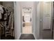 En-suite bathroom with large soaking tub viewed through the doorway from the walk-in closet at 2026 Indian Sky Cir, Lakeland, FL 33813