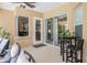 Charming outdoor patio with stylish seating, high-top table, and access to the home's interior at 2026 Indian Sky Cir, Lakeland, FL 33813