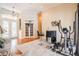 Sitting area with exercise equipment, bar, and French doors to the home's entrance at 2026 Indian Sky Cir, Lakeland, FL 33813
