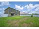 Spacious backyard with lush green grass and a white privacy fence, perfect for outdoor activities at 2062 Blue Highlands Dr, Lakeland, FL 33811