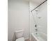Bathroom featuring tiled walls, a bathtub, toilet, and neutral paint at 2062 Blue Highlands Dr, Lakeland, FL 33811