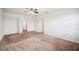 Large bedroom with neutral carpet and multiple doors leading to other rooms at 2062 Blue Highlands Dr, Lakeland, FL 33811