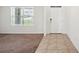 Bright entryway featuring ceramic tile flooring leading to carpeted area at 2062 Blue Highlands Dr, Lakeland, FL 33811
