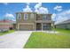 Charming two-story home with a well-manicured lawn and two car garage at 2062 Blue Highlands Dr, Lakeland, FL 33811
