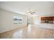Open concept living room with bright window views, flowing into the kitchen area with countertops at 2062 Blue Highlands Dr, Lakeland, FL 33811