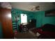 Cozy bedroom with fish tank and ceiling fan at 240 Lake Thomas Dr, Winter Haven, FL 33880