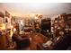 Spacious living room with brown couches, ceiling fan and patterned rug at 240 Lake Thomas Dr, Winter Haven, FL 33880