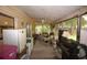 Enclosed porch area offering an outdoor living space with appliances at 240 Lake Thomas Dr, Winter Haven, FL 33880