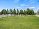 Spacious yard with a white fence and lake view offers a private, serene setting at 2544 Ladoga Dr, Lakeland, FL 33805