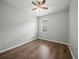 Bedroom with wood floors, a ceiling fan, and a window for natural light at 2544 Ladoga Dr, Lakeland, FL 33805