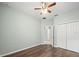 Bright bedroom features wood floors, closet, and ceiling fan at 2544 Ladoga Dr, Lakeland, FL 33805