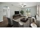 Bright living room featuring neutral tones, contemporary furnishings, and sliding glass doors to the backyard at 2544 Ladoga Dr, Lakeland, FL 33805