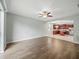 Open-concept living room and kitchen with hardwood floors and stainless steel appliances at 2544 Ladoga Dr, Lakeland, FL 33805