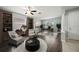 Bright living room with built-in bookshelves, stylish furniture, and large windows at 2544 Ladoga Dr, Lakeland, FL 33805