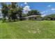 Well-maintained backyard with expansive green space, ideal for outdoor activities and enjoying the natural surroundings at 2714 Highlands Vue Pkwy, Lakeland, FL 33813