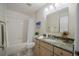 Clean bathroom with tub and shower combination, tiled walls and modern vanity at 2714 Highlands Vue Pkwy, Lakeland, FL 33813