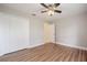 Bedroom with wood floors, closet and ceiling fan at 2714 Highlands Vue Pkwy, Lakeland, FL 33813
