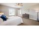 Inviting bedroom with neutral colors, ceiling fan, carpeted floors, and ample natural light, creating a relaxing atmosphere at 2714 Highlands Vue Pkwy, Lakeland, FL 33813
