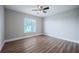 Bright bedroom with laminate flooring and natural light from a window at 2714 Highlands Vue Pkwy, Lakeland, FL 33813