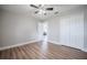 Bedroom with wood floors, walk-in closet and a ceiling fan at 2714 Highlands Vue Pkwy, Lakeland, FL 33813