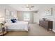Cozy bedroom with carpeted floors, ceiling fan, natural light and neutral tones, creating a comfortable and calming space at 2714 Highlands Vue Pkwy, Lakeland, FL 33813