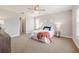 Serene bedroom featuring a ceiling fan, carpeted floors, neutral tones, and natural light for a tranquil retreat at 2714 Highlands Vue Pkwy, Lakeland, FL 33813