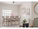 Cozy dining room area features tile flooring and a stylish ceiling fan, and space for six at 2714 Highlands Vue Pkwy, Lakeland, FL 33813