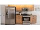 This kitchen's sleek stainless-steel appliances and granite countertops deliver a stylish and functional cooking experience at 2714 Highlands Vue Pkwy, Lakeland, FL 33813