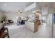 Open-concept kitchen, living, and dining area with tile floors and modern fixtures at 2714 Highlands Vue Pkwy, Lakeland, FL 33813
