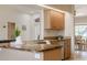Well-lit kitchen features wooden cabinetry, granite countertops, stainless steel appliances, and an eat-in nook with natural light at 2714 Highlands Vue Pkwy, Lakeland, FL 33813