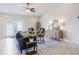 Comfortable living room featuring modern decor, tiled floors and a ceiling fan at 2714 Highlands Vue Pkwy, Lakeland, FL 33813