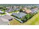An aerial view of a single-story home with a fenced backyard and a private outdoor living space at 2817 High Winds Ln, Lakeland, FL 33813